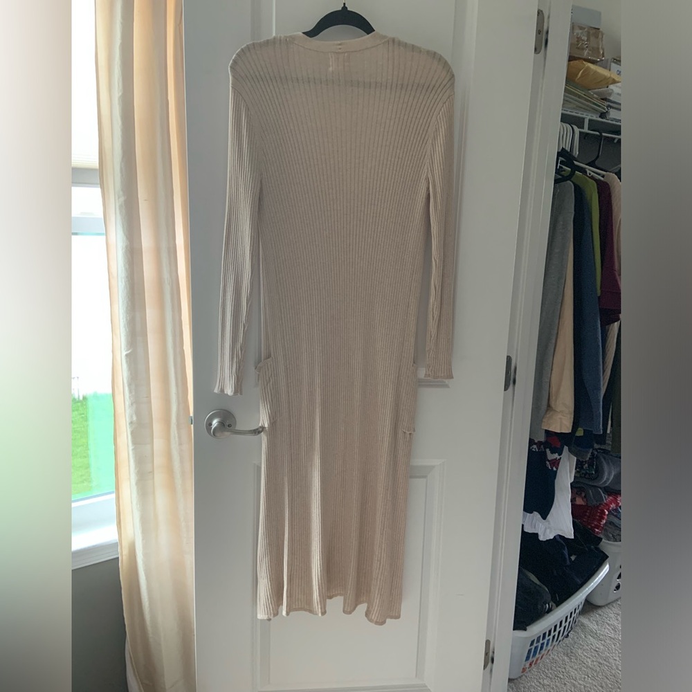 Light silky champagne, colored long cardigan. Late spot above pocket.